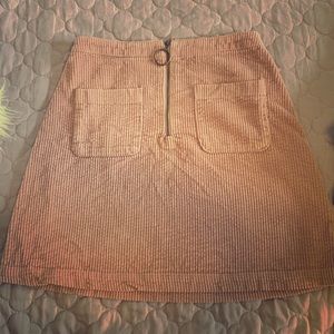 Pink corduroy mini skirt with pockets